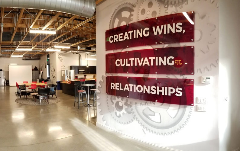 Creating Wins, Cultivating Relationship tagline at JP Marketing office in Fresno, CA