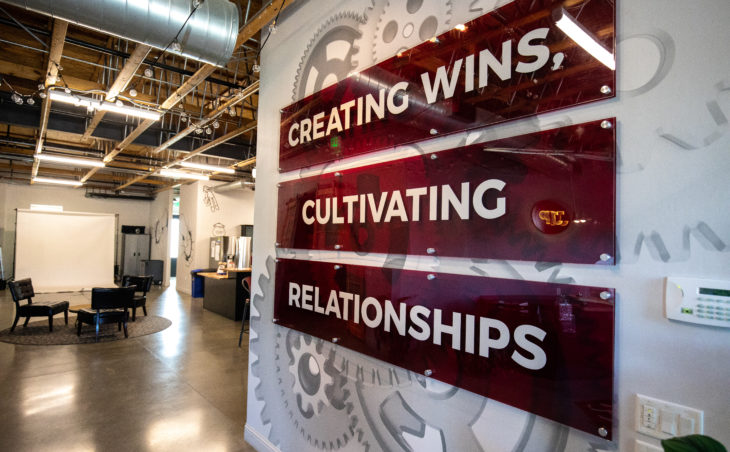Creating wins, cultivating relationships office sign