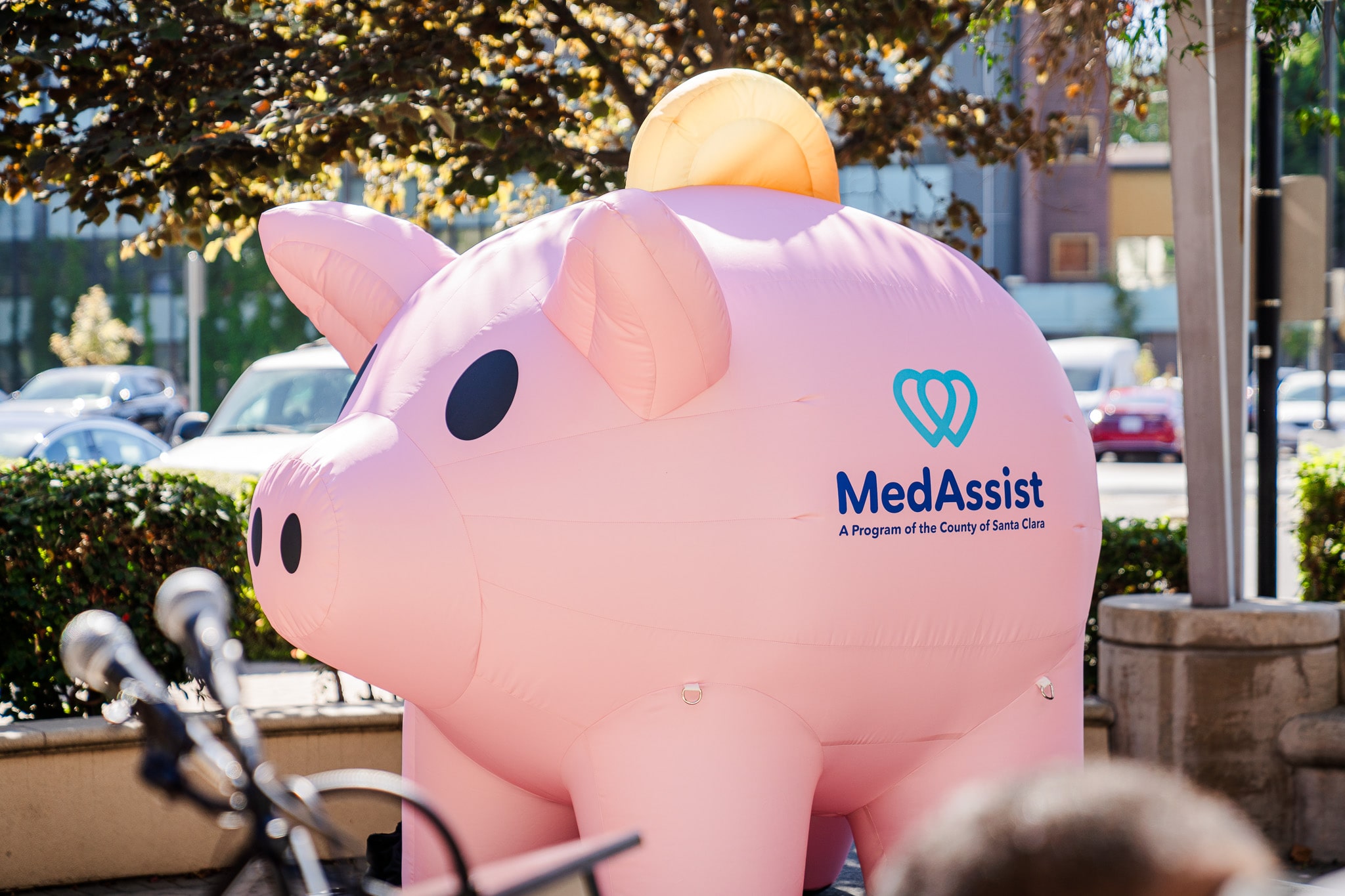 A life-size, inflatable rendition of MedAssist's mascot: A piggy bank.